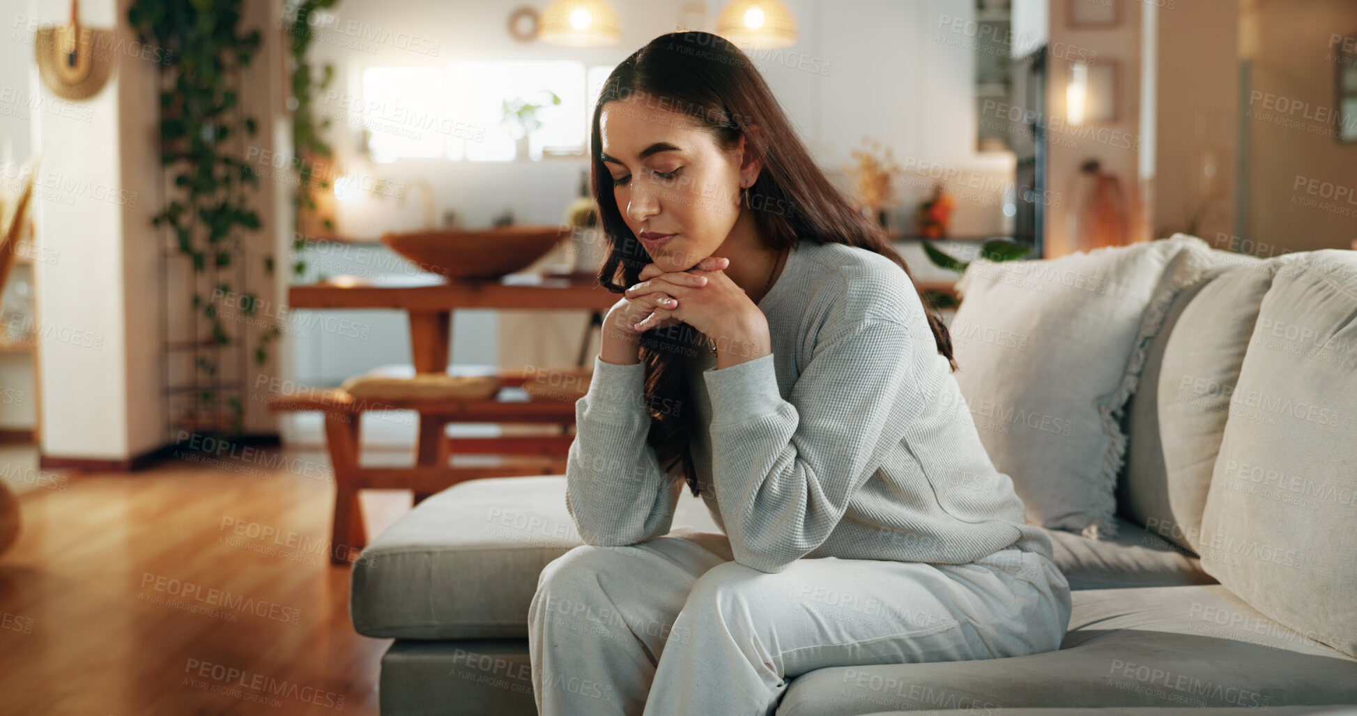 Buy stock photo Woman, sad and thinking on sofa in home with depression, break up or remember mistake in living room. Girl, person or unhappy with broken heart on couch for failure, regret and mental health in house