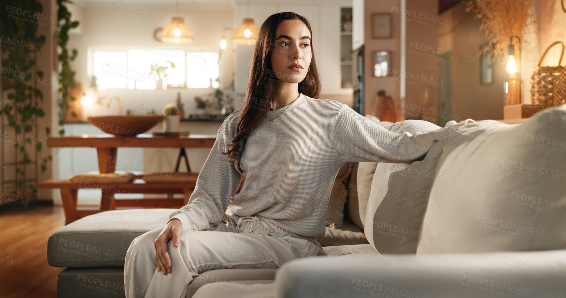 Buy stock photo Calm, idea and serious with woman on sofa in living room of home for contemplation or wellness. Future, thinking and vision with confident person in apartment for memories, nostalgia or planning