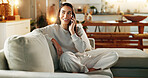 Woman, phone call and smile on couch in home with communication, digital contact and conversation. Happy person, thinking or chat on sofa for online order, delivery update and tracking in living room