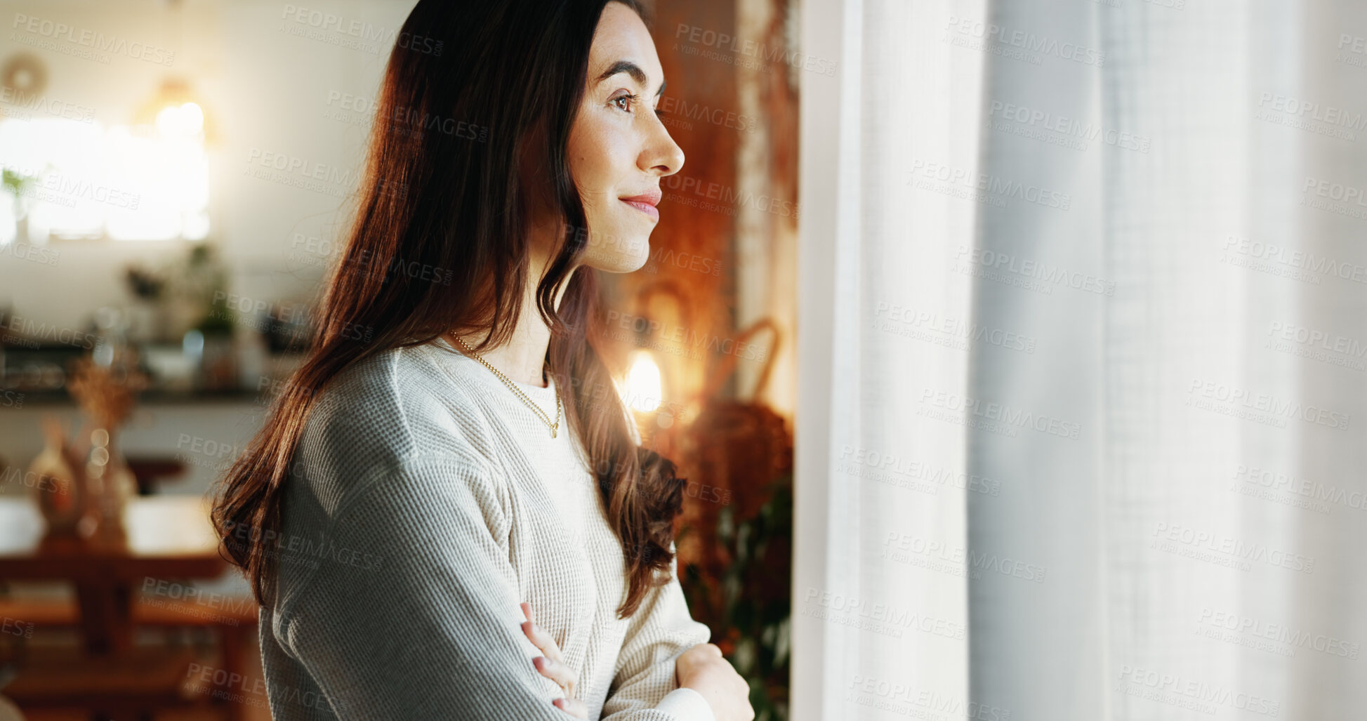 Buy stock photo Woman, arms crossed and thinking by window in home with daydreaming, reflection and happy memory in lounge. Girl, person and thoughtful in living room with wondering, remember or nostalgia with relax