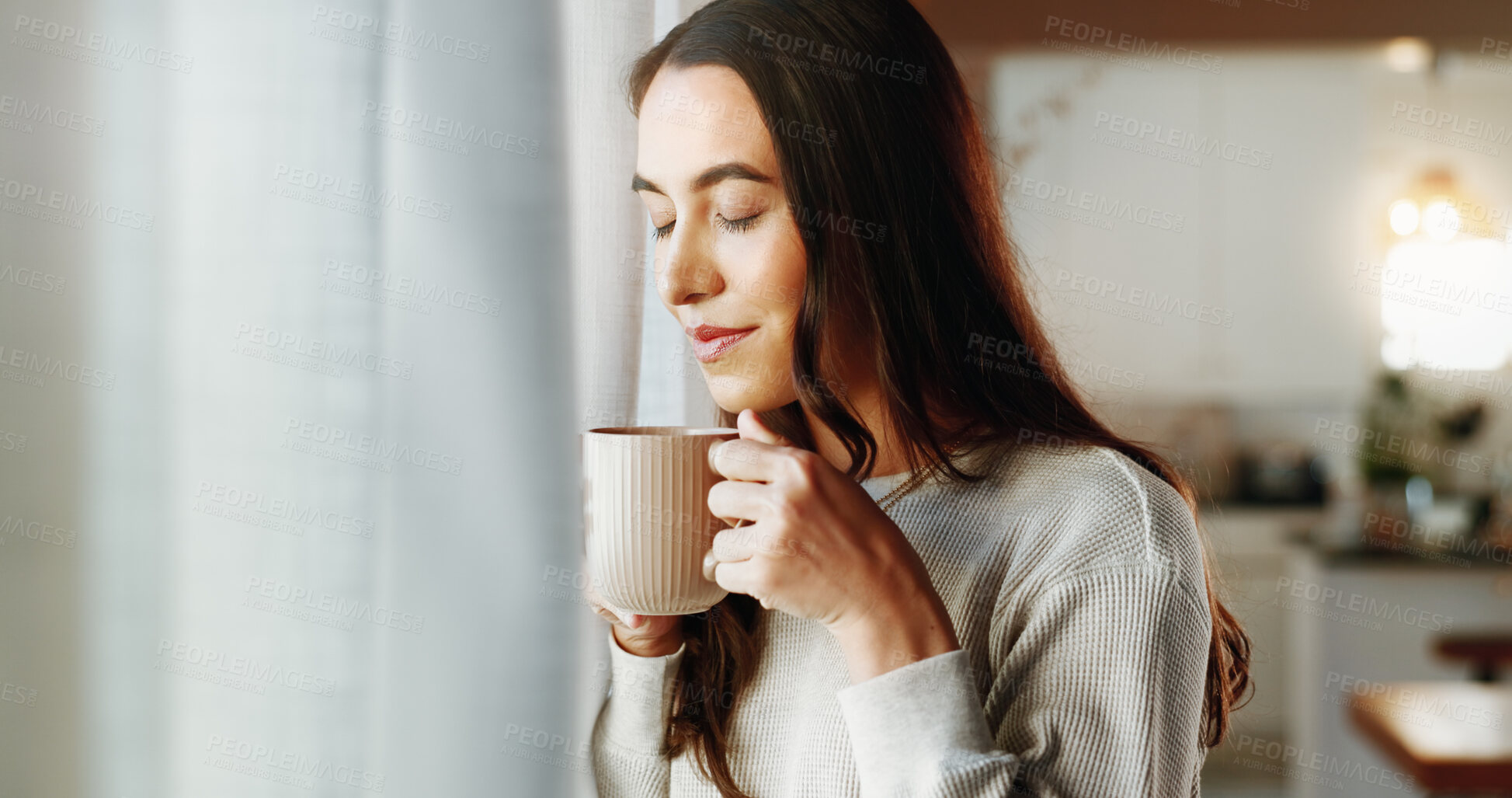 Buy stock photo Woman, smell and smile with coffee in home for relax, morning caffeine and scent by window. Girl, person and drinking tea in house with natural aroma, happy memory and reflection to unwind in lounge