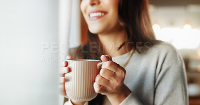 Buy stock photo Woman, hands and smile with coffee in home for relax, morning caffeine and thinking by window. Girl, person and drinking tea in house for inspiration, happy memory and daydreaming to unwind in lounge