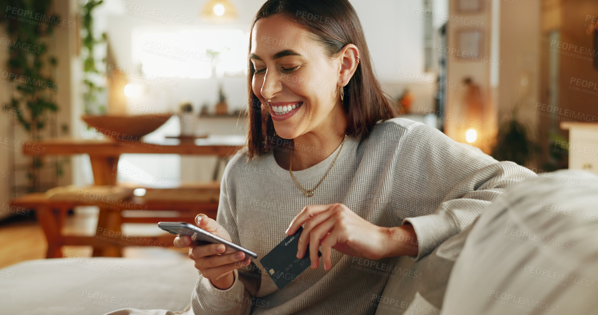 Buy stock photo Woman, phone and credit card with smile on sofa for online shopping, digital payment and internet banking in home. Girl, person and smartphone for debit purchase, electronic transaction and ecommerce