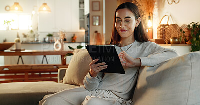 Buy stock photo App, smile and tablet with woman on sofa in living room of home for online shopping at night. Ecommerce, relax and technology with happy person in apartment for social media browsing on weekend