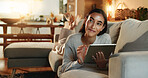 Smile, tablet and thinking with woman on sofa in living room of home for purchase decision. Ecommerce, online shopping and technology with happy person in apartment for budget, choice or option