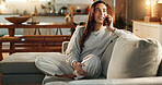 Woman, phone call and smile on sofa in home with communication, digital contact and conversation. Happy person, thinking or chat on couch for online order, delivery update and tracking in living room