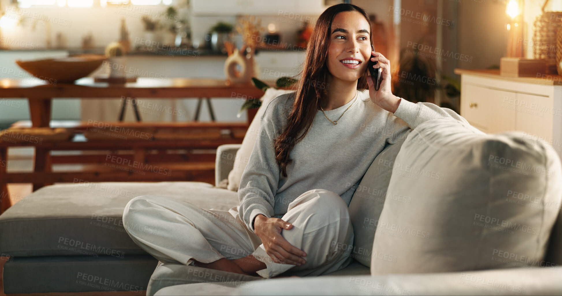 Buy stock photo Woman, phone call and smile on sofa in home with communication, digital contact and conversation. Happy person, thinking or chat on couch for online order, delivery update and tracking in living room