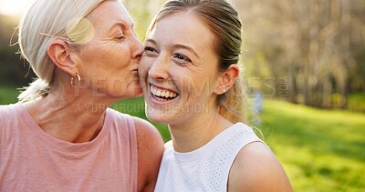 Buy stock photo Senior mom, kiss woman and park with smile, kindness or reunion for bonding, love and family in sunshine. People, mature mother and daughter in countryside for connection, excited or happy in Germany