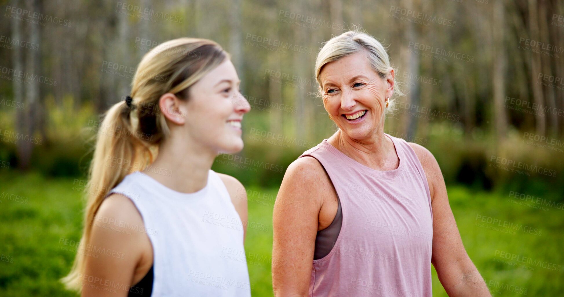 Buy stock photo Mother, daughter or talking in forest with hiking for fitness adventure, sightseeing or explore nature. Laughing, mature woman or girl in woods with walking, holiday travel or bonding on outdoor path