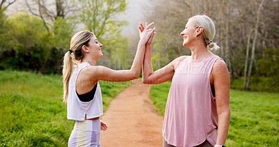 Buy stock photo Fitness, women and high five in nature for support, well done and energy for exercise. Mature mother, girl and hand gesture on mountain trail for motivation, healthy relationship or bonding with care