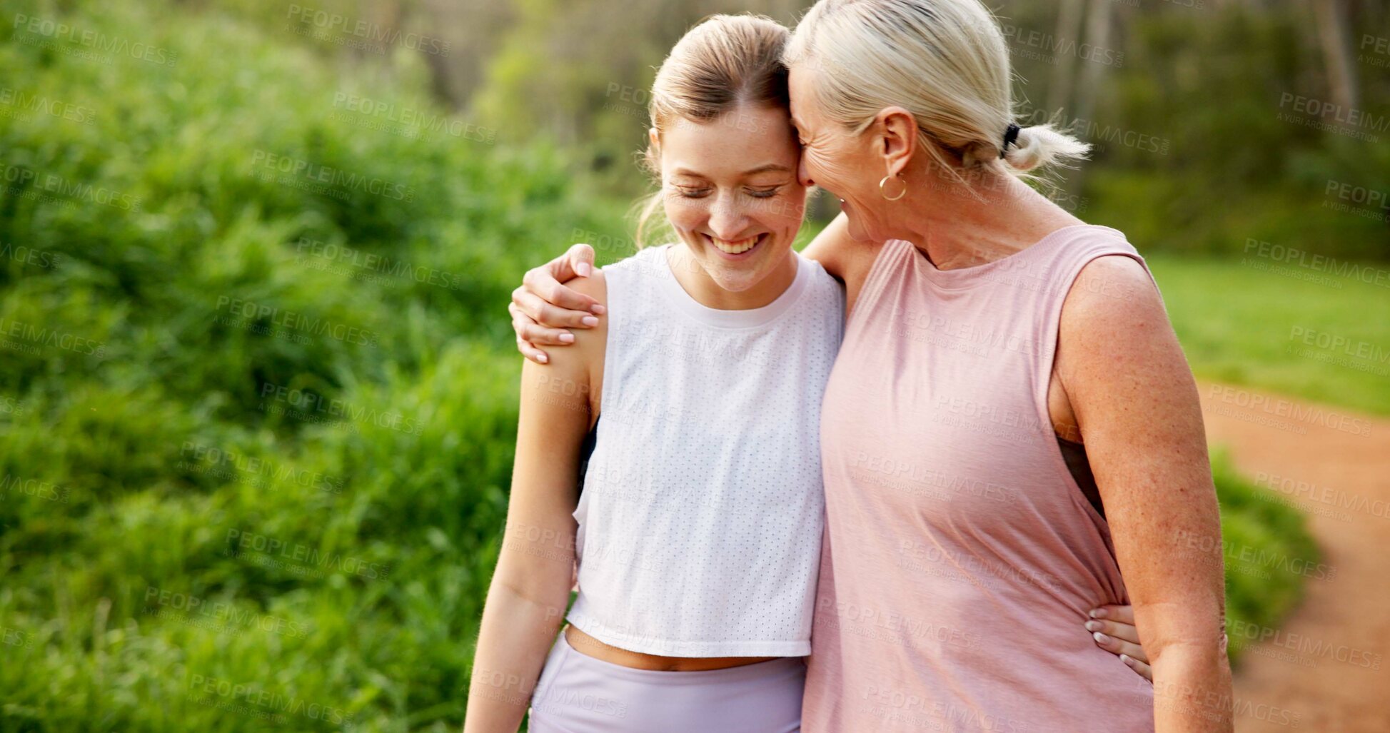 Buy stock photo Mother, daughter or together in forest with hiking for fitness adventure, sightseeing or explore nature. Embrace, mature woman or girl in woods with walking, holiday travel or talking on outdoor path