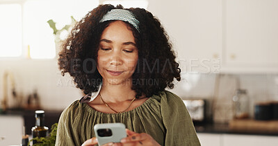 Buy stock photo Woman, typing and phone in kitchen for contact, text message and research recipe ideas in app. Girl, mobile and connectivity in home for social media, communication and smile for weekend planning