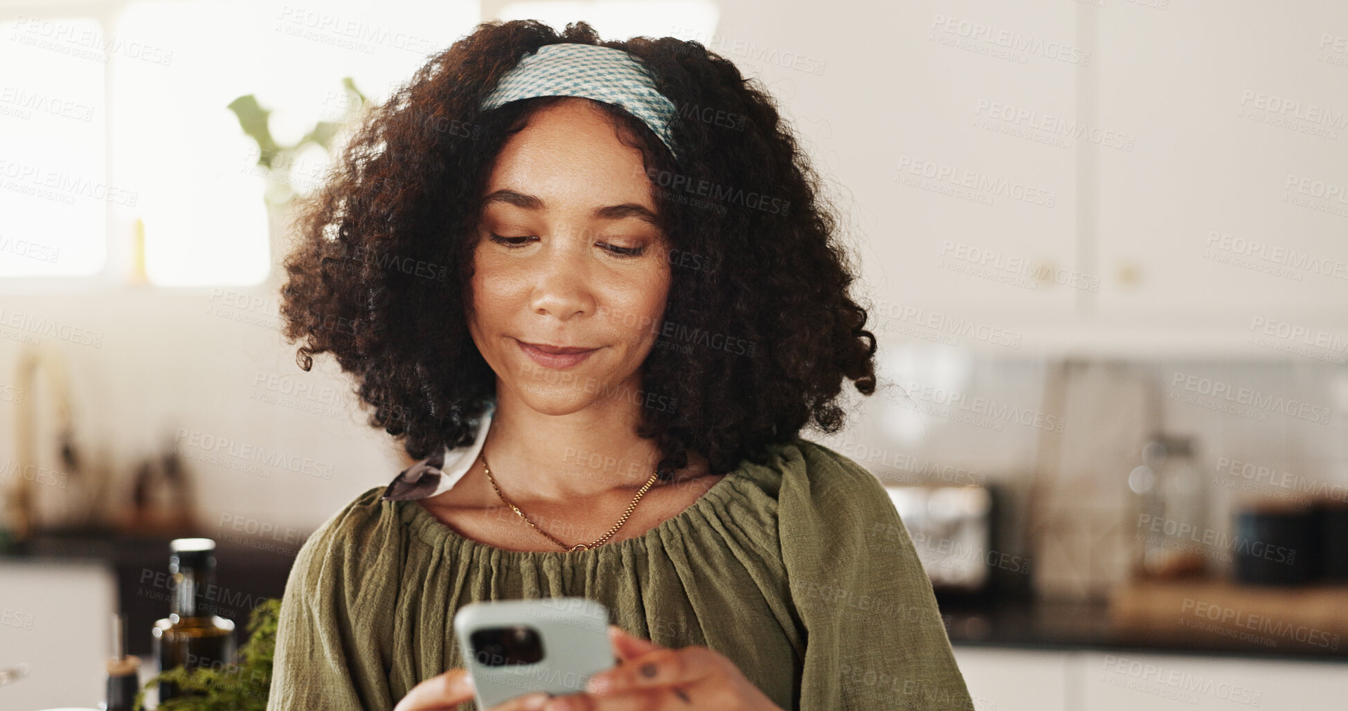 Buy stock photo Woman, typing and phone in kitchen for contact, text message and research recipe ideas in app. Girl, mobile and connectivity in home for social media, communication and smile for weekend planning