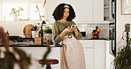 Woman, online and phone in kitchen for social media, text message and research recipe ideas. Girl, mobile and connectivity in home for blog app review, communication and relax with weekend planning