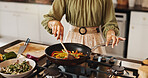 Stirring, pan and hands with spoon, kitchen and meal prep of healthy food, cooking and breakfast in home. Morning, nutritionist and person with vegetables, process and gas stove for heat and frying