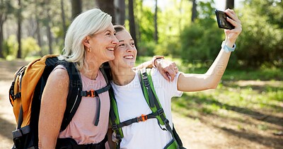 Buy stock photo Nature, hiking and women with hug for selfie, document memory and bonding for profile picture. Outdoor, senior mother and daughter with photography for social media, fitness experience and wellness