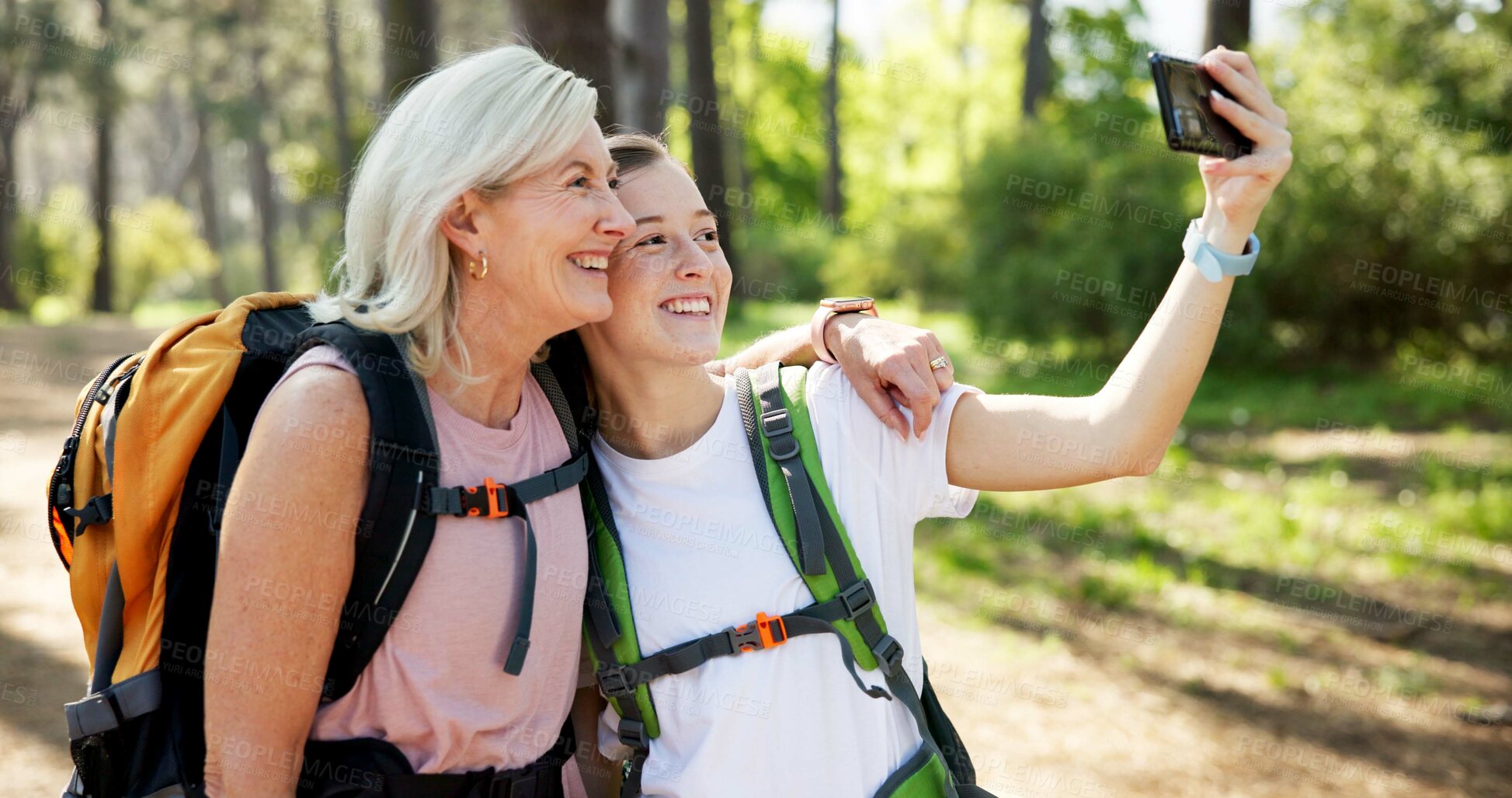 Buy stock photo Nature, hiking and women with hug for selfie, document memory and bonding for profile picture. Outdoor, senior mother and daughter with photography for social media, fitness experience and wellness