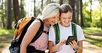 Mama, adult daughter and smartphone with hiking, lost or fitness with vacation, bonding together and network. Nature, outdoor or hiker with mother, cellphone and woods with digital app or travelling