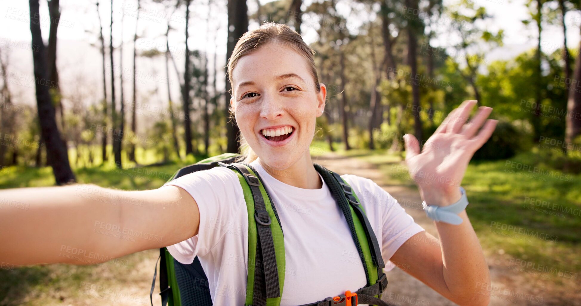 Buy stock photo Happy woman, portrait and hiking with backpack for video call, travel memory or live streaming adventure in forest. Female person, influencer or selfie with bag or wave for trekking journey in woods