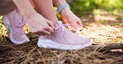 Buy stock photo Woman, hands and tying shoes with laces for hiking or fitness in nature, forest or woods. Closeup, female person or athlete tie with sneakers or getting ready for run, trekking or outdoor exercise