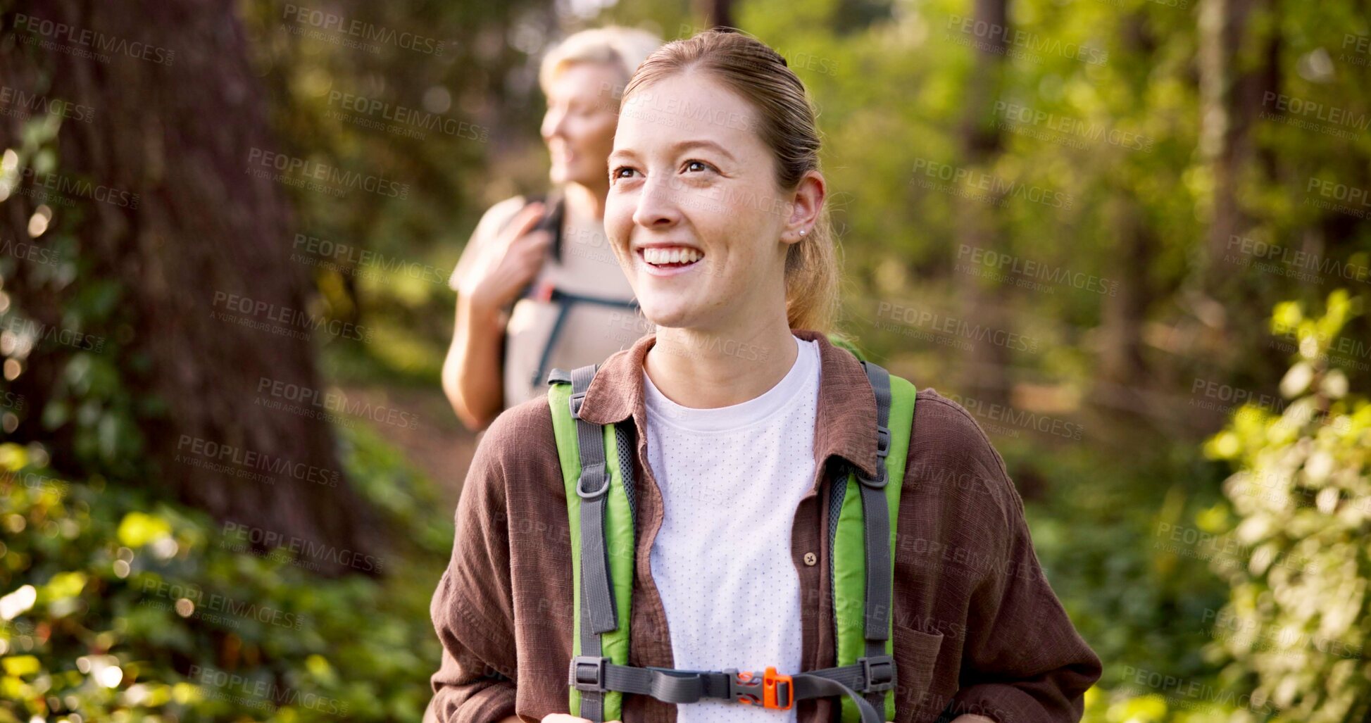 Buy stock photo Happy woman, hiking or forest with backpack for adventure, sightseeing or travel in nature. Female people, hiker or friends with smile, bag or equipment for outdoor trekking journey together in woods