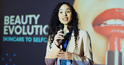 Buy stock photo Woman, presentation and stage with talking at conference for beauty evolution with info for change in industry. Person, speaker and employee with mic for cosmetics company at international convention