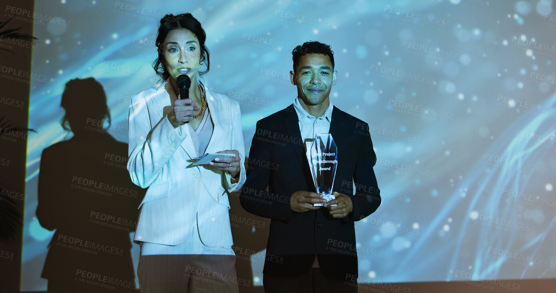 Buy stock photo Presentation, conference and business people with award on a stage at tradeshow, convention and seminar. Public speaking, audience and men and women for achievement, thank you and winning at event