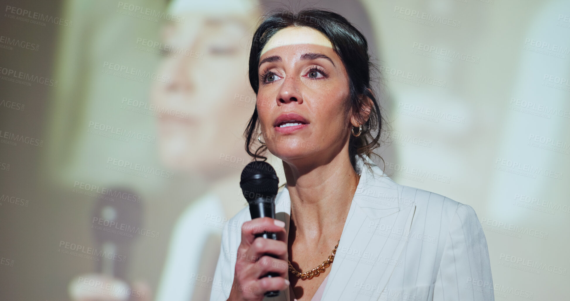 Buy stock photo Business, presenter and woman at seminar with microphone, screen and presentation of corporate ideas. Speech, speaker and businesswoman on stage for conference on development, growth and solution