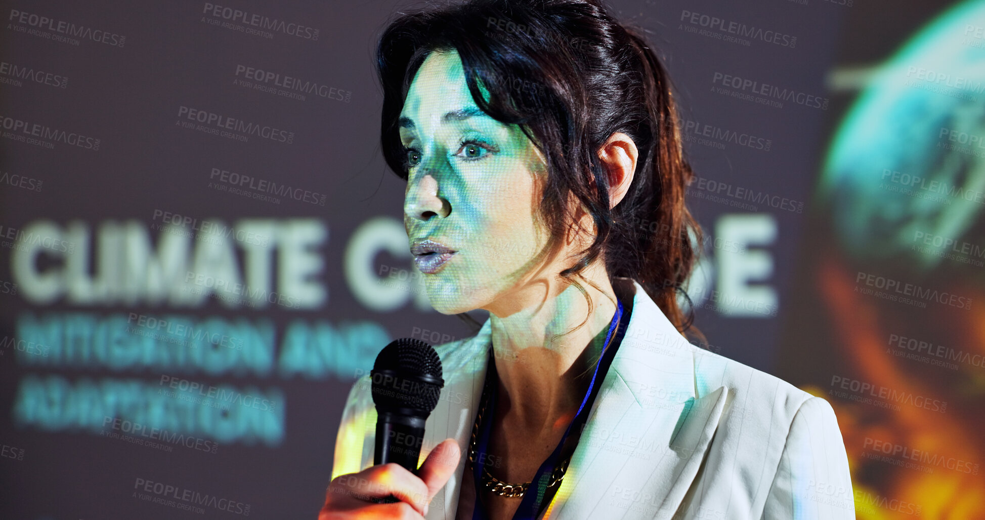 Buy stock photo Presentation, public speaking and woman on a stage for climate change tradeshow, convention and seminar. Conference, audience and person with mic for event, sustainability and global warming crisis