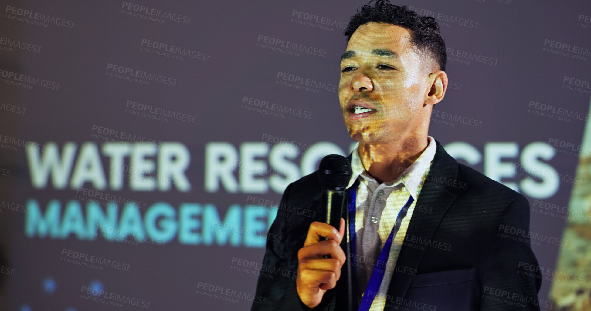 Buy stock photo Stage, presenter and man at seminar with microphone,  presentation and ideas for water management. Climate change, resources and speaker at screen for conference on global solution for sustainability