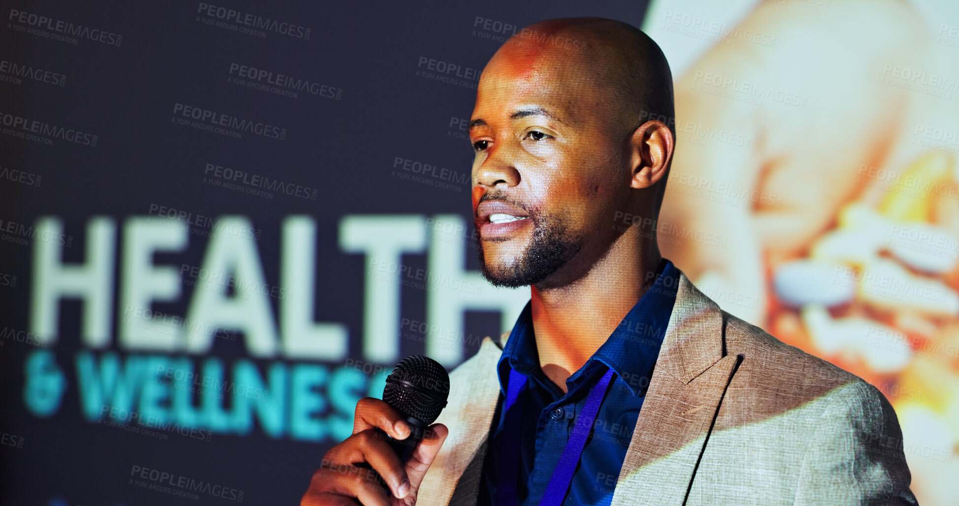 Buy stock photo Presentation, convention and man on a stage for healthcare tradeshow, conference and seminar. Public speaking, audience and African person with mic for medical, wellness and hospital accessibility