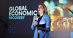 Stage, speaker and woman at seminar with microphone,  tablet and global economic recovery ideas. Trade, resources and presenter at screen for conference on financial development, growth and solution