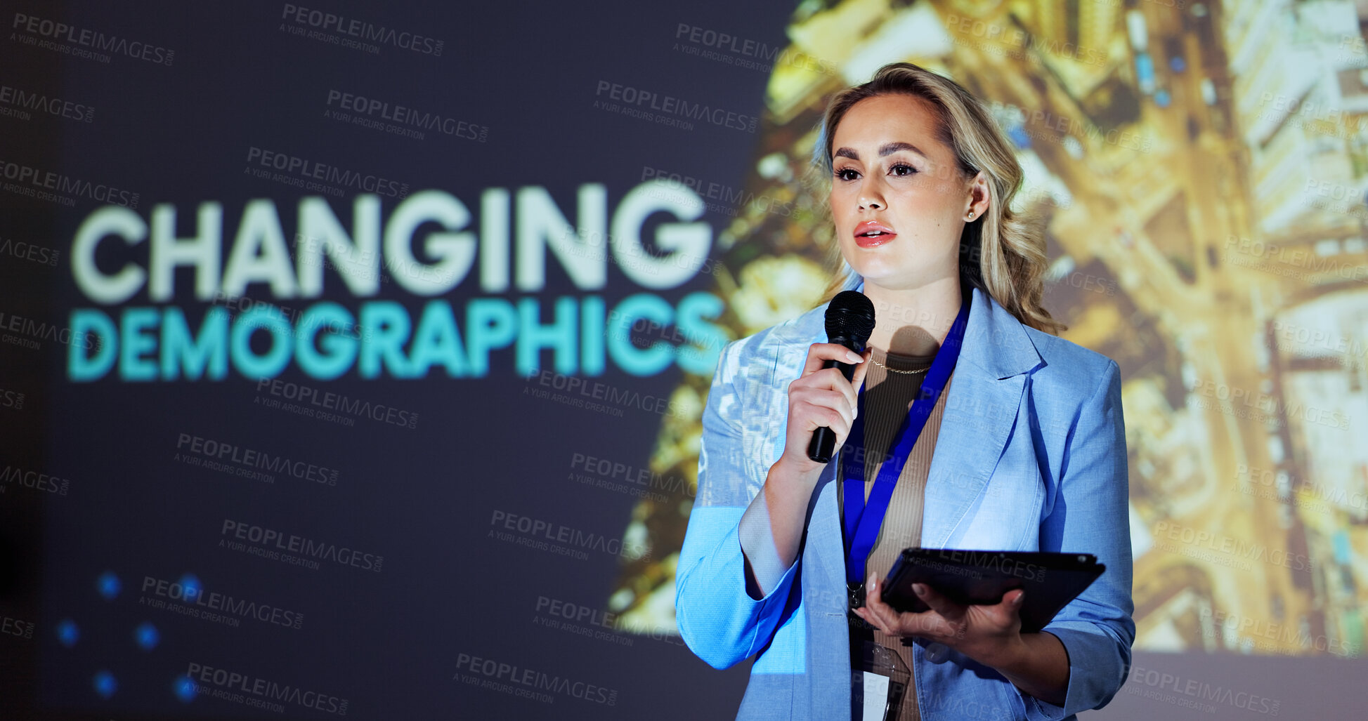 Buy stock photo Presenter, conference and woman on a stage with statistics for mortality, population growth and birth or death rate. Public speaking, audience and person on tablet at tradeshow, convention or seminar