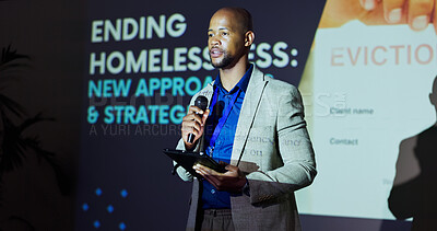 Buy stock photo African man, presentation and stage at convention for homeless crisis with call to action for problem solving. Person, speaker and housing activist with speech, tablet and strategy at conference