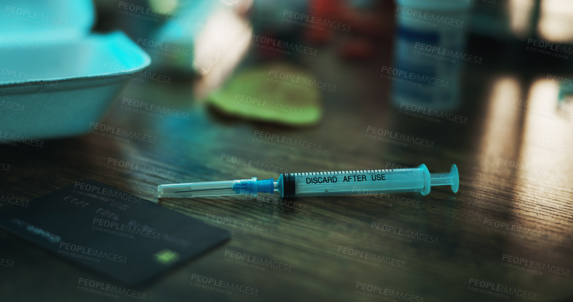 Buy stock photo Drugs, addiction and needle on table in dark apartment with opioid crisis, crime and danger. Risk, substance abuse and syringe with injection of fentanyl, narcotics or toxic habit in home at night