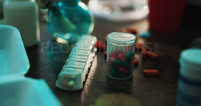 Buy stock photo Drugs, addiction and pills on table in dark apartment with opioid crisis, crime and danger. Risk, substance abuse and pharmaceutical narcotics with tablet, medicine or toxic habit in home at night