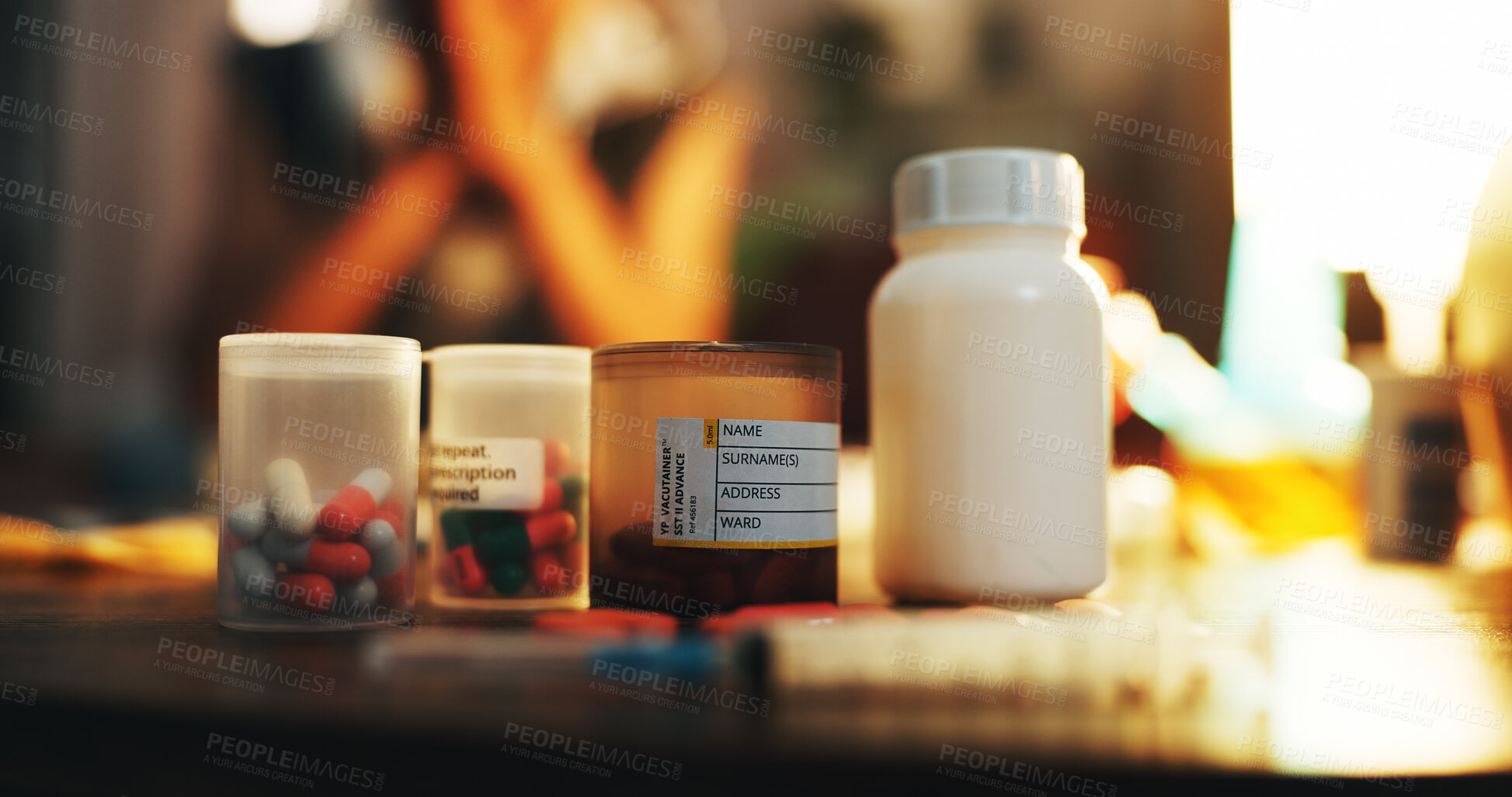 Buy stock photo Drugs, container and pills on table in dark apartment with opioid crisis, crime and danger. Risk, substance abuse and medicine with pharmaceutical narcotics, poison or toxic habit in home at night