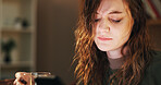 House, alcohol and sad woman with cellphone, depression and mental health with stress in lounge. Person, apartment or girl with smartphone, wine or grief with anxiety, loss or frustrated with message