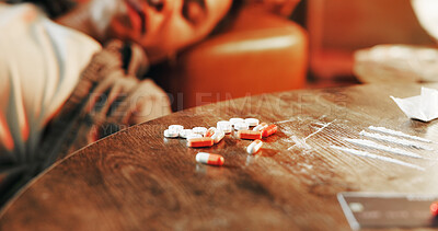 Buy stock photo Drugs, overdose and man on sofa with pills, health risk and narcotic danger in apartment at night. Blackout, addiction and person in living room with toxic lines, fentanyl and cocaine crisis in home