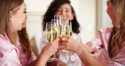 Buy stock photo Cheers, bridesmaid and champagne with women in bedroom for wedding day, bridal party and support. Celebration, sleepover and event with people at home for ceremony, maid of honor and engagement toast