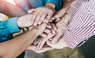 Buy stock photo Diverse business people stack hands together showing support, teamwork and motivation or success for a project in the office. Group of colleagues cooperate and celebrate success after a meeting