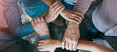 Buy stock photo Top view of co-workers hand put together in an expression of unity and team spirit