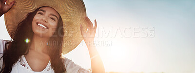 Buy stock photo Shot of an attractive young woman standing outside in a field