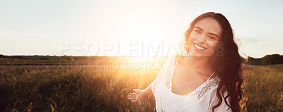 Buy stock photo Portrait of an attractive young woman standing outside in a field