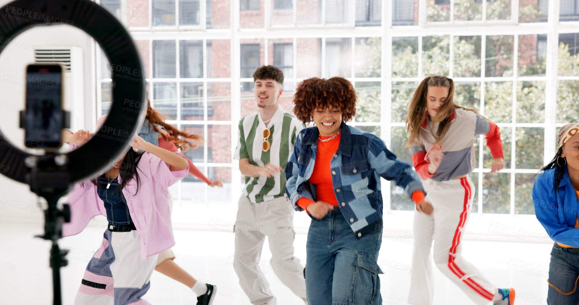 Buy stock photo Ring light, group and dancing in studio, people and training for performance, influencer and energy. Talent, team or hip hop crew with online pitch for competition, practice or culture with smile