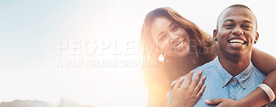 Buy stock photo Portrait of a happy young couple enjoying a piggyback ride outdoors