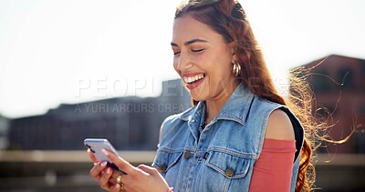 Buy stock photo Woman, phone and laughing for message in city, reading funny meme and online for social media surfing. Female person, outdoor and app for humor in communication, silly notification and holiday fun