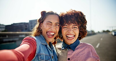 Buy stock photo Outdoor selfie, people and goofy portrait in city, photography and confident for street fashion. Women, friends and tongue out for comedy in relationship, gen z style and social media post on weekend