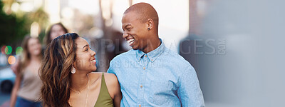 Buy stock photo Shot of two happy young couples taking a walk through the city