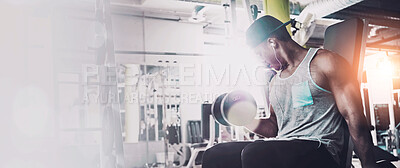 Buy stock photo Shot of a man doing a upper-body workout at the gym